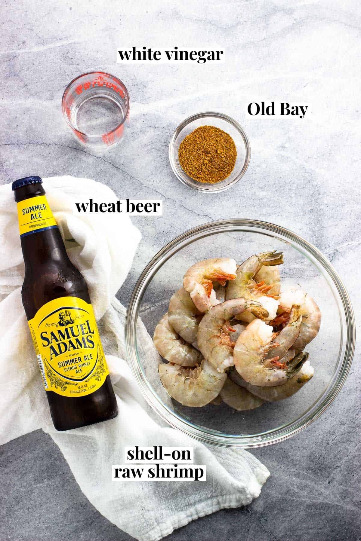 Ingredients labeled with their names: white vinegar, Old Bay, wheat beer, and shell-on raw shrimp.