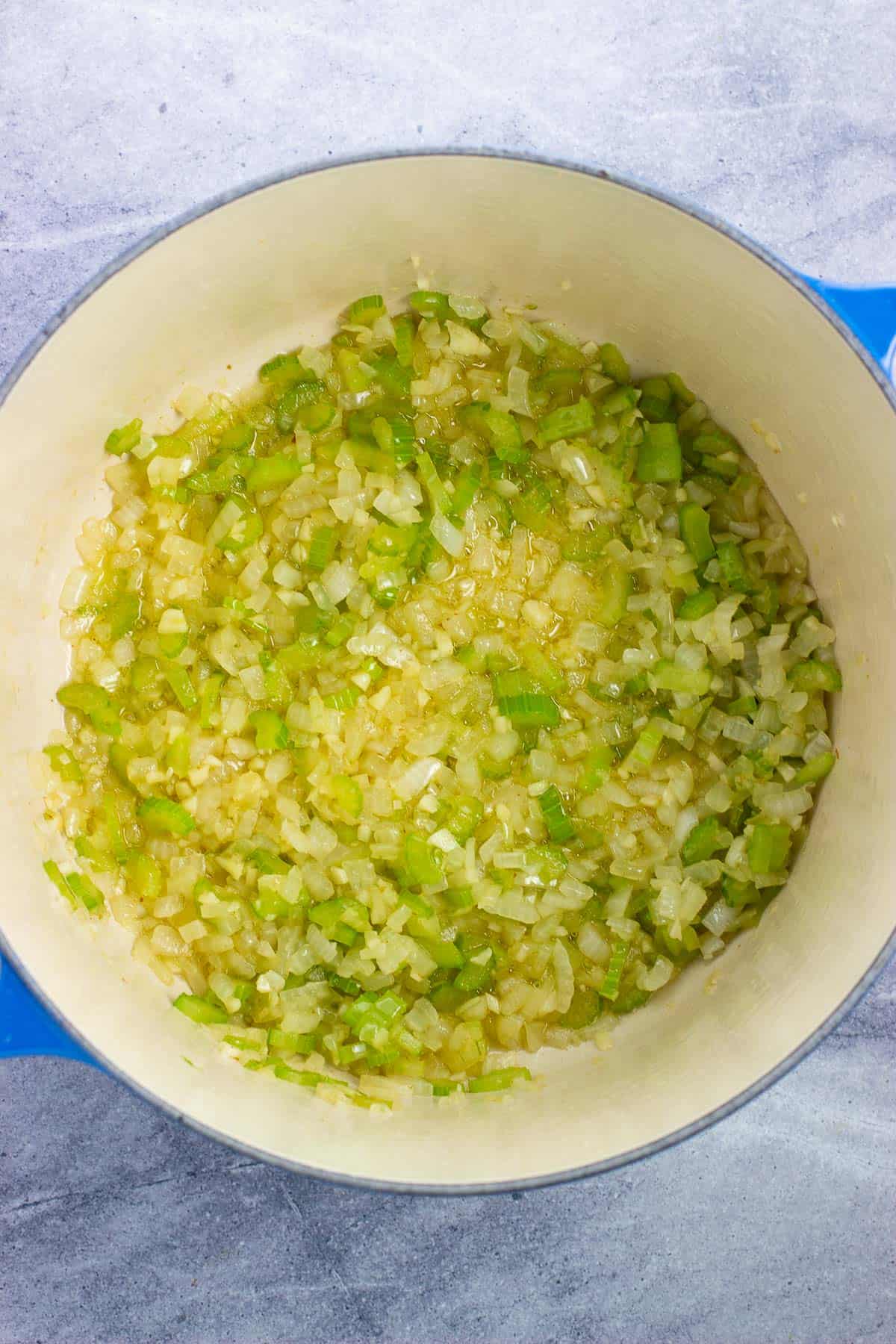 Sautéed onion, celery, and garlic in a Dutch oven.