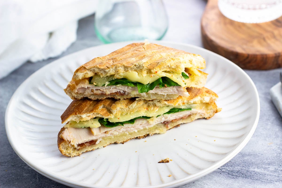 Two halves of a ciabatta panini stacked on top of one another.