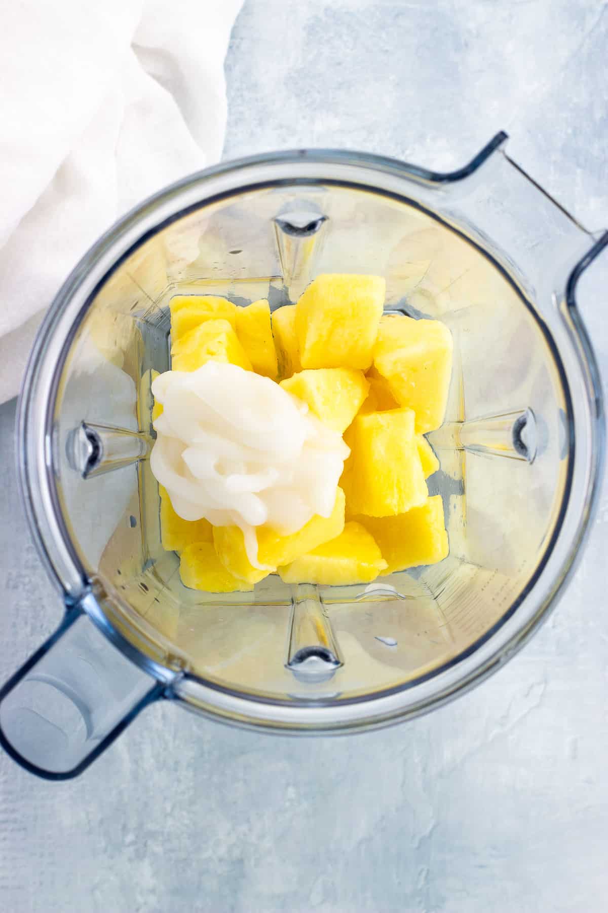 Drink ingredients added to a blender before blending.