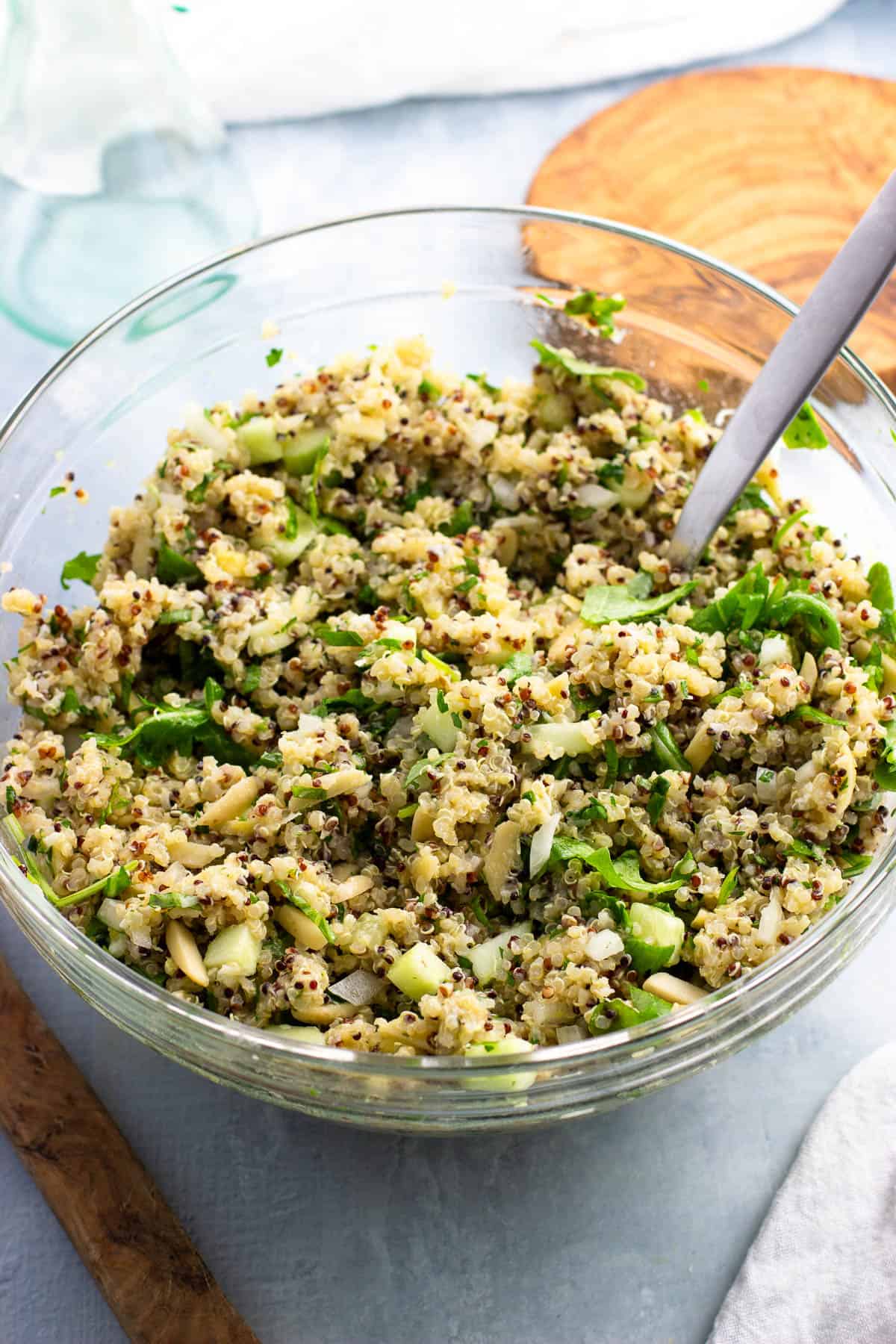 Lemon quinoa salad with Parmesan and herbs in a glass bowl.