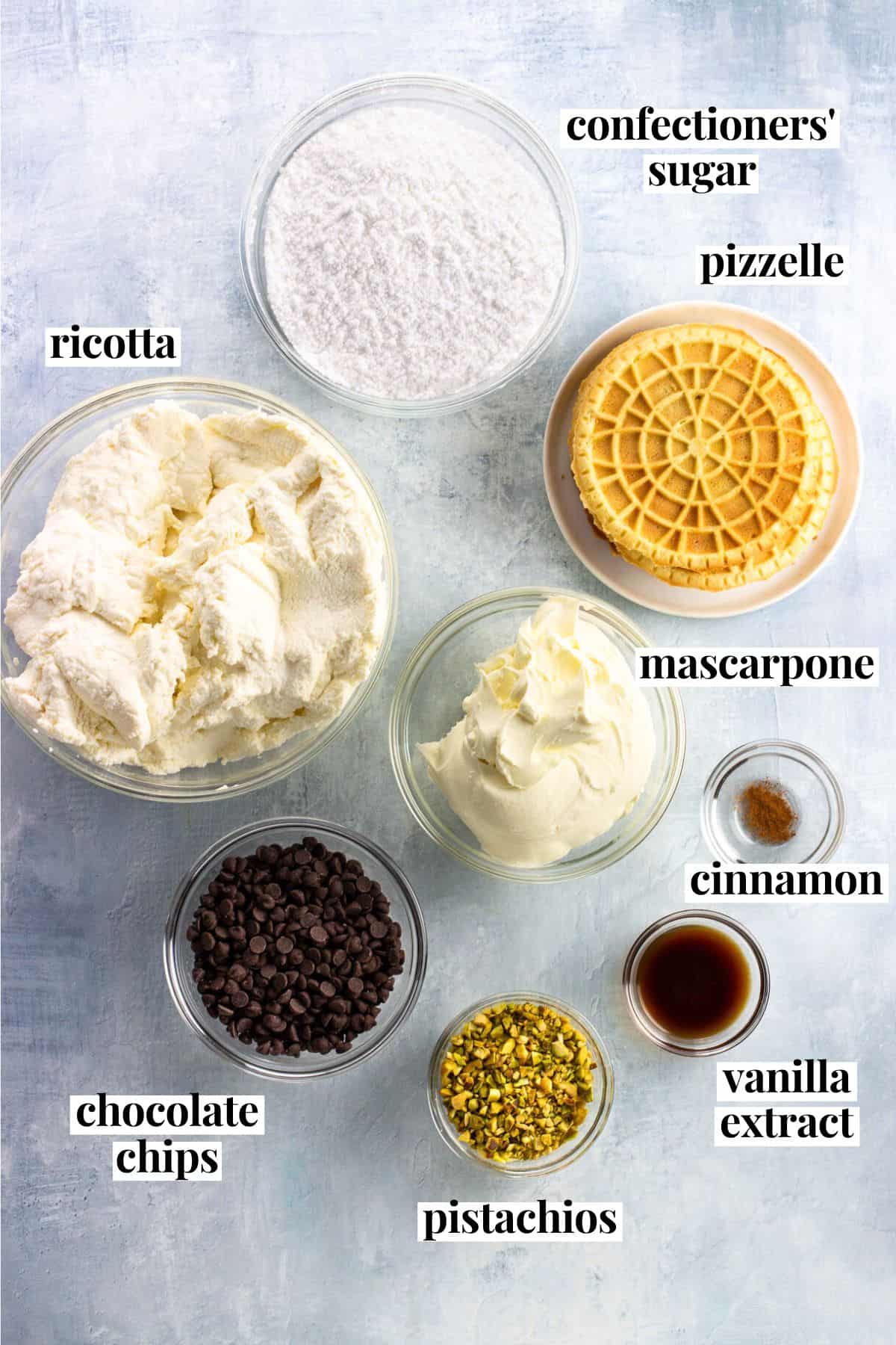 Labeled cannoli icebox cake ingredients in separate containers.