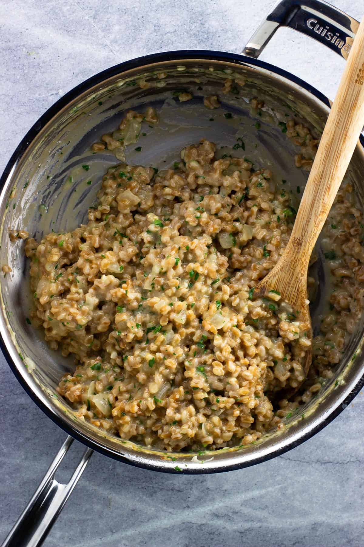 Farrotto in a pan after stirring in balsamic vinegar.