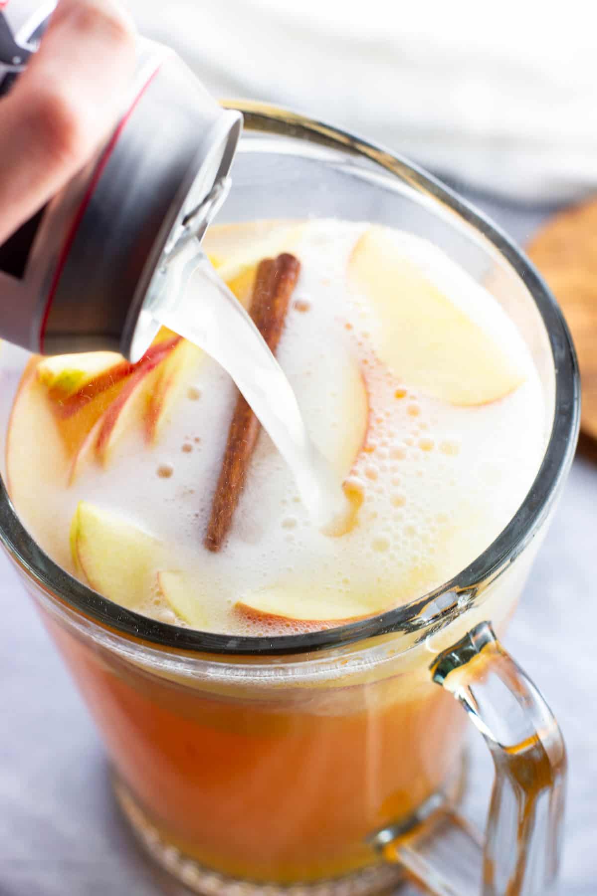 Ginger beer being poured into the sangria.