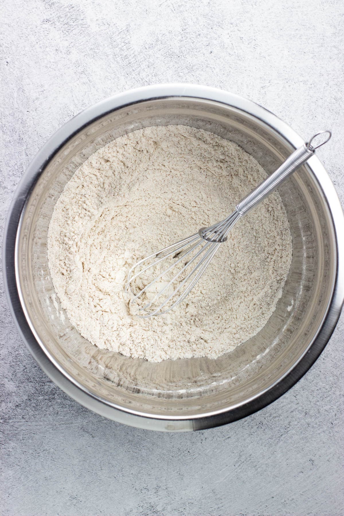 Dry ingredients whisked together in a bowl.