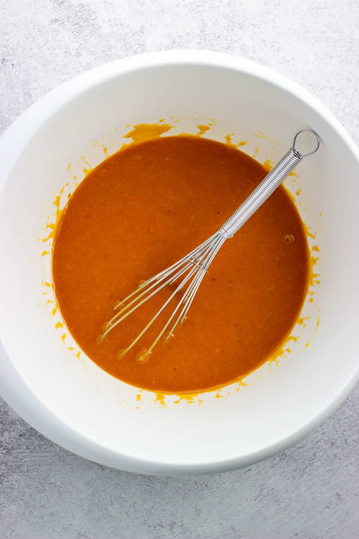 Combined wet ingredients in a bowl.