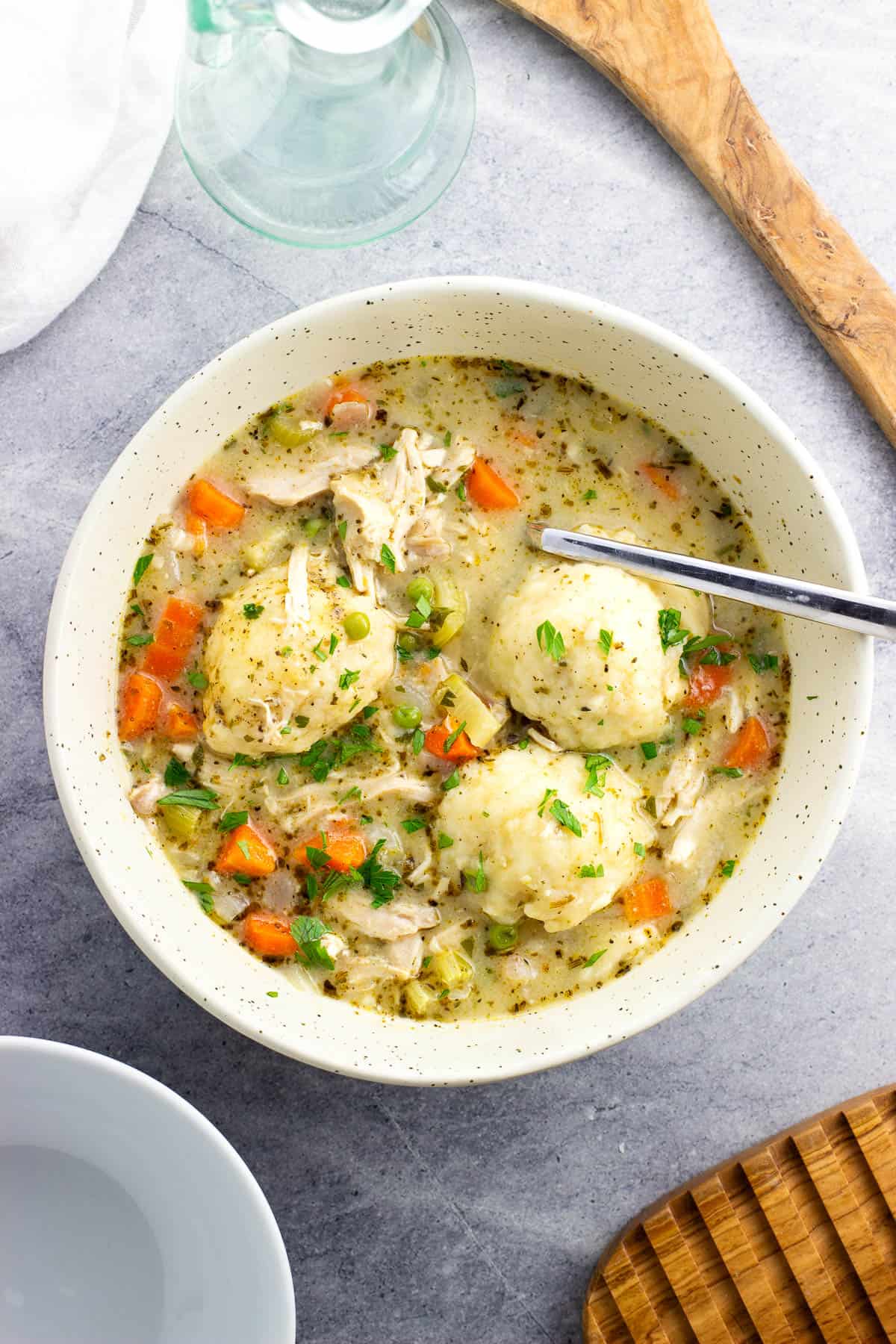 Easy chicken and dumplings in a bowl with a spoon.