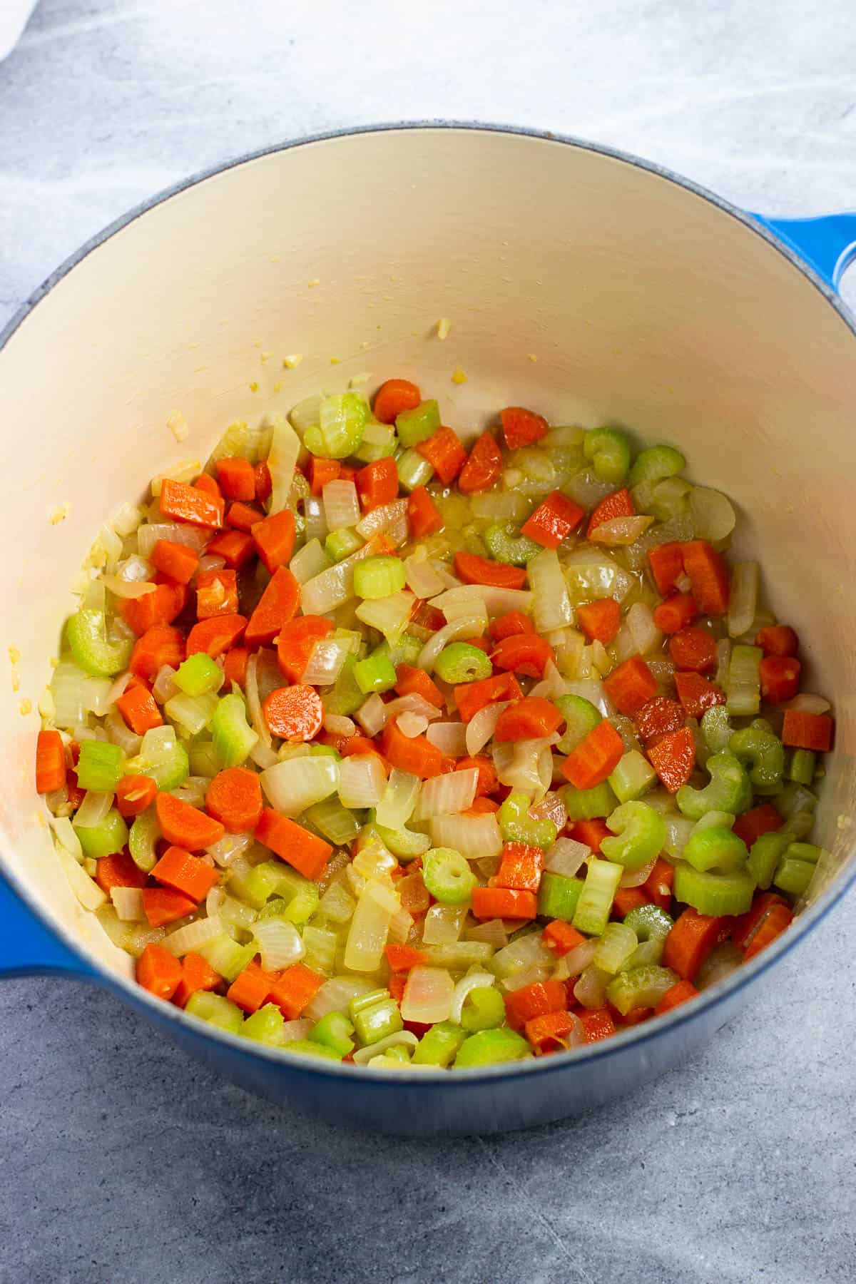 Sautéed vegetables in a Dutch oven.