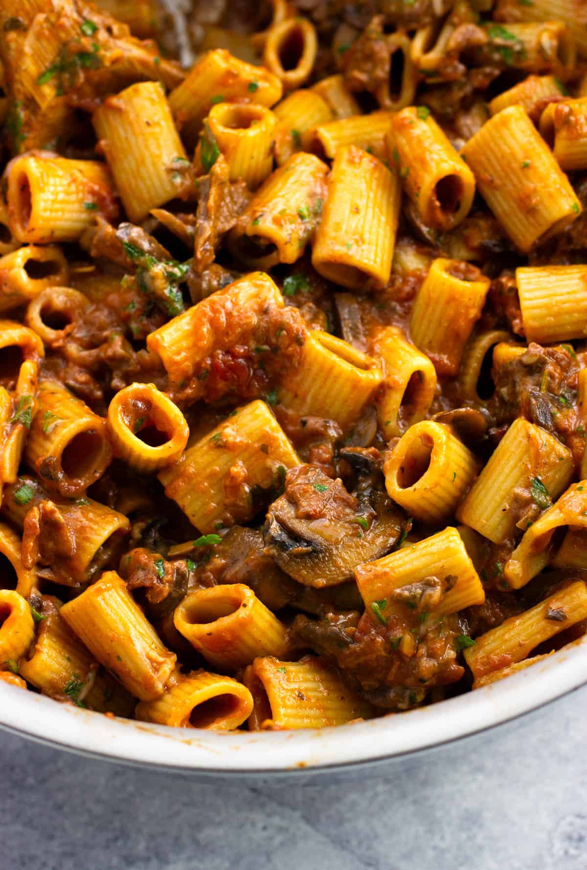 Rigatoni boscaiola in a pan.