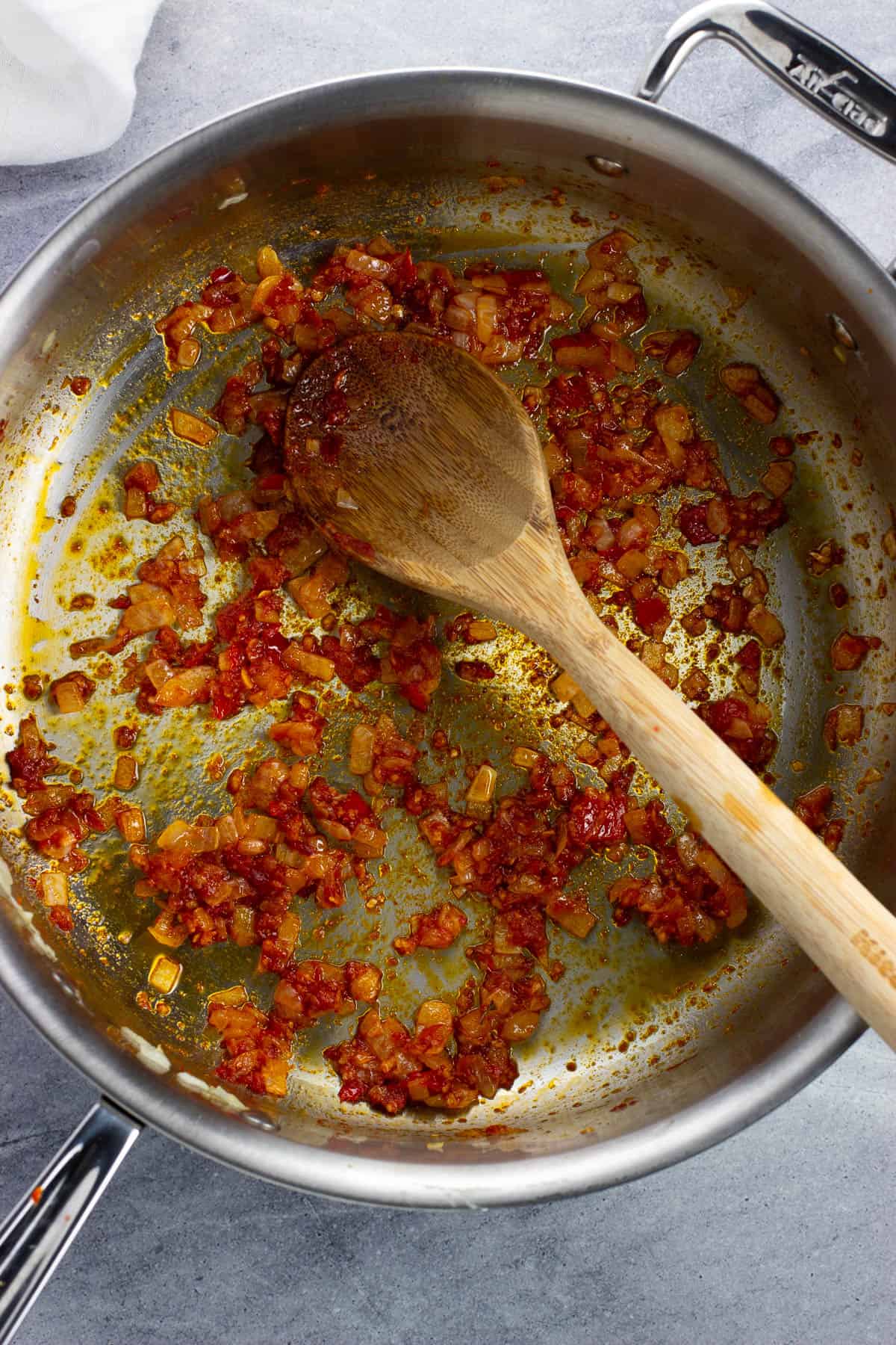 Onions and garlic cooked with tomato paste.