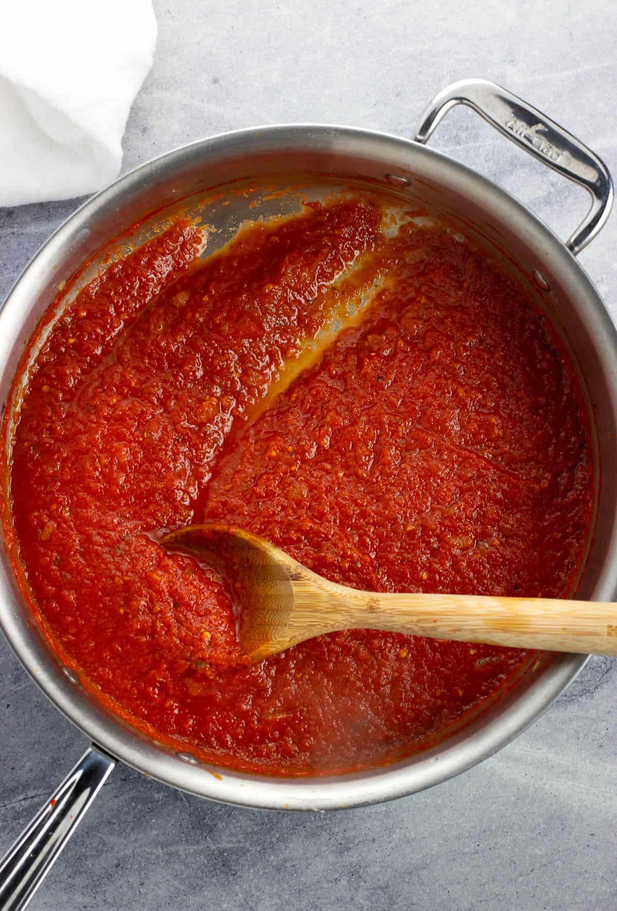 Crushed tomatoes in the pan after being simmered.