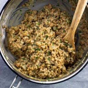 Farrotto in a pan after stirring in balsamic vinegar.