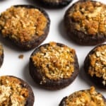 Baked stuffed mushrooms on a plate.