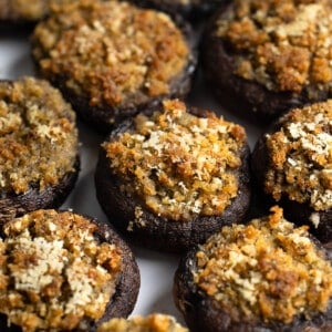 A serving plate of Italian stuffed mushrooms.