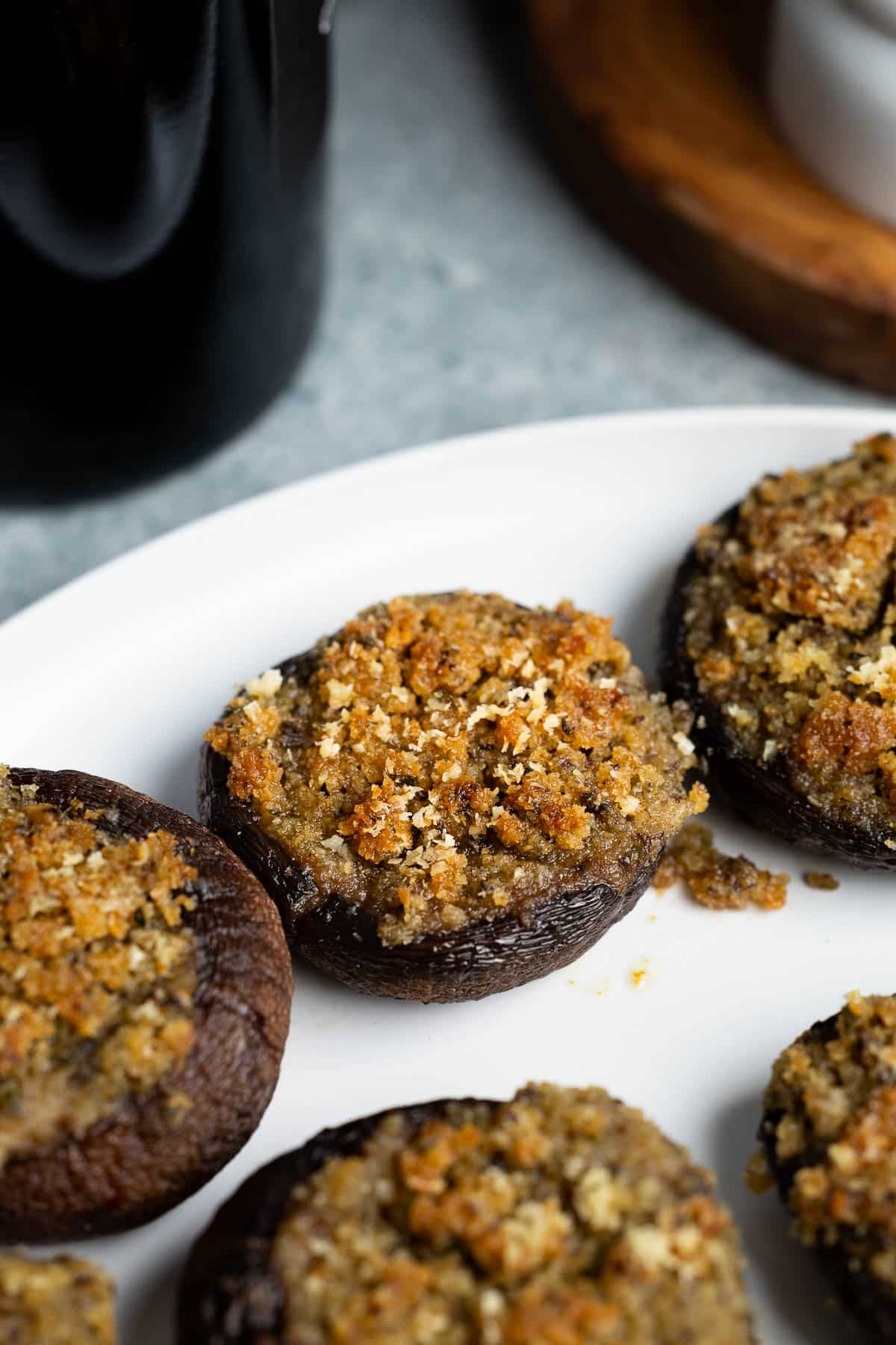 Stuffed mushrooms on a plate after being baked.