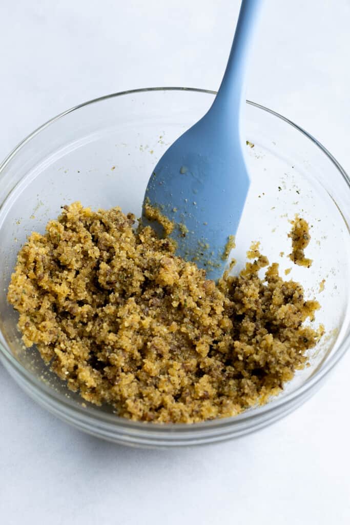 The breadcrumb mixture stirred together in a bowl.