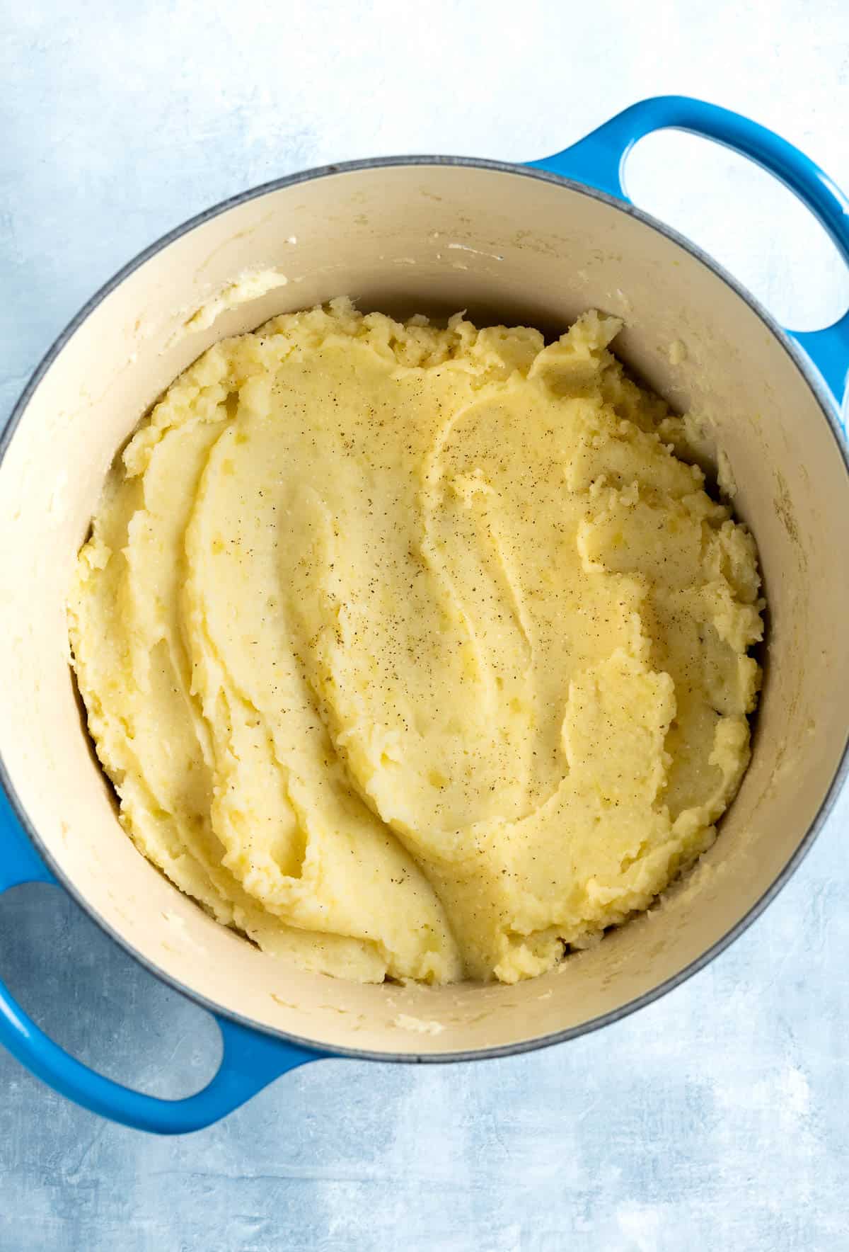 Creamy sour cream mashed potatoes in a Dutch oven.