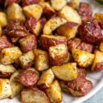 Roasted garlic rosemary potatoes on a plate.