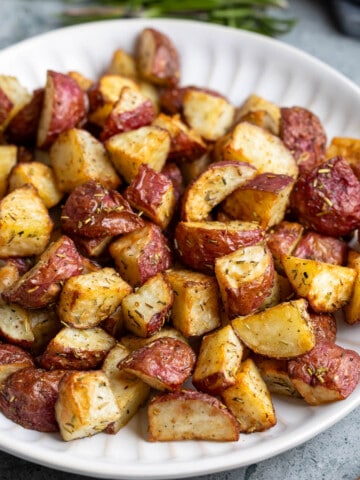 A serving plate of air fryer red potatoes.