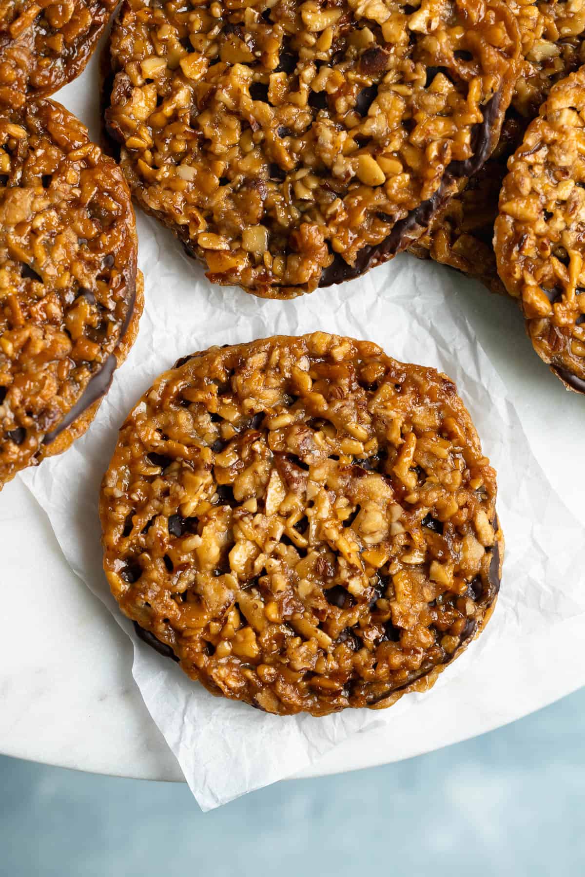 Almond lacy cookies held together with dark chocolate.