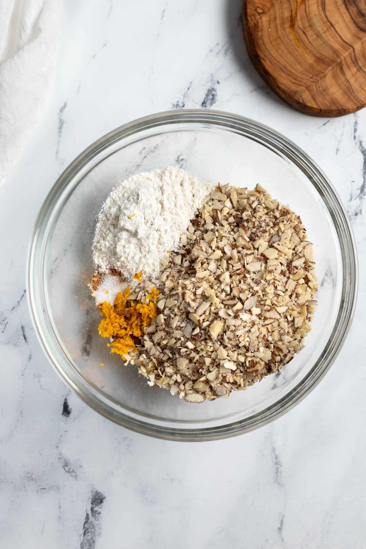 The dry ingredients added to a mixing bowl.