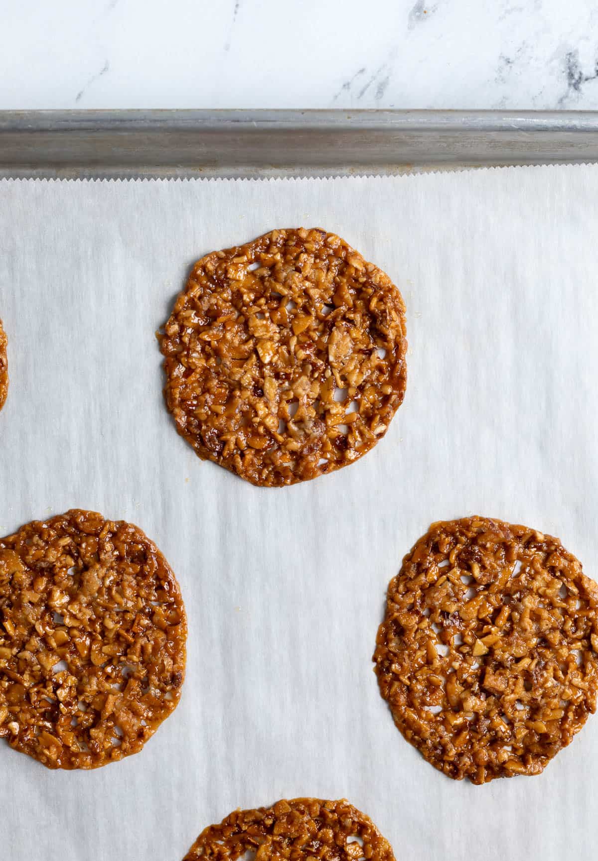 Baked florentine cookies on a pan.