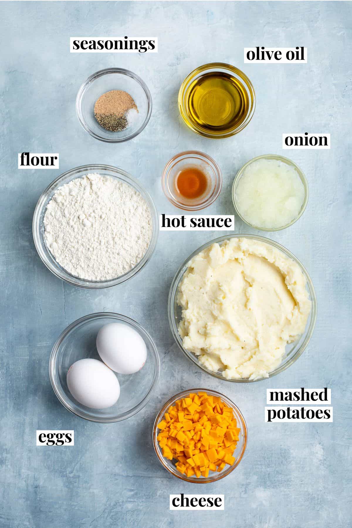 Labeled mashed potato cake recipe ingredients in separate bowls.