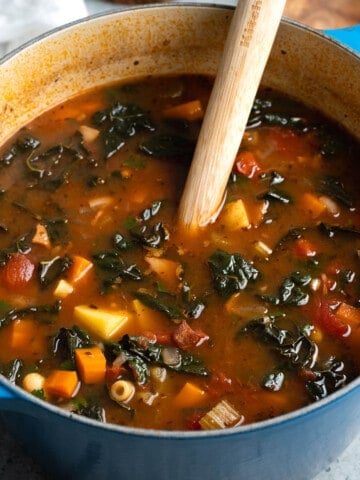 Minestrone soup in a round pot ready to serve.