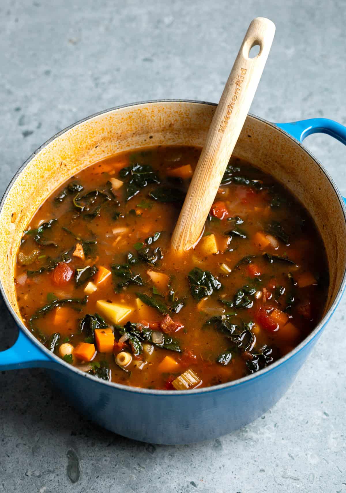Minestrone soup in a round pot ready to serve.
