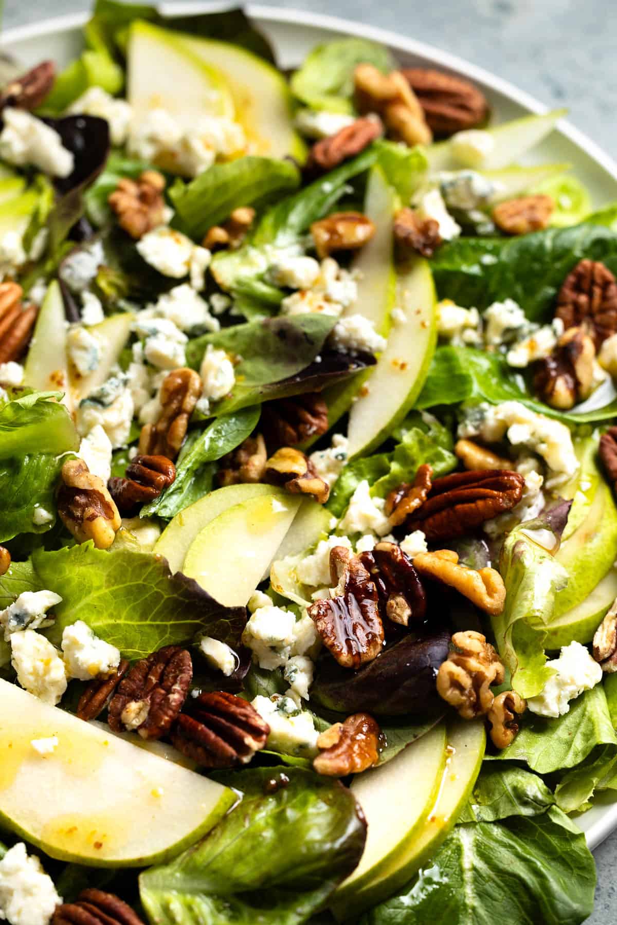 Dressing drizzled over a pear Gorgonzola salad to serve.