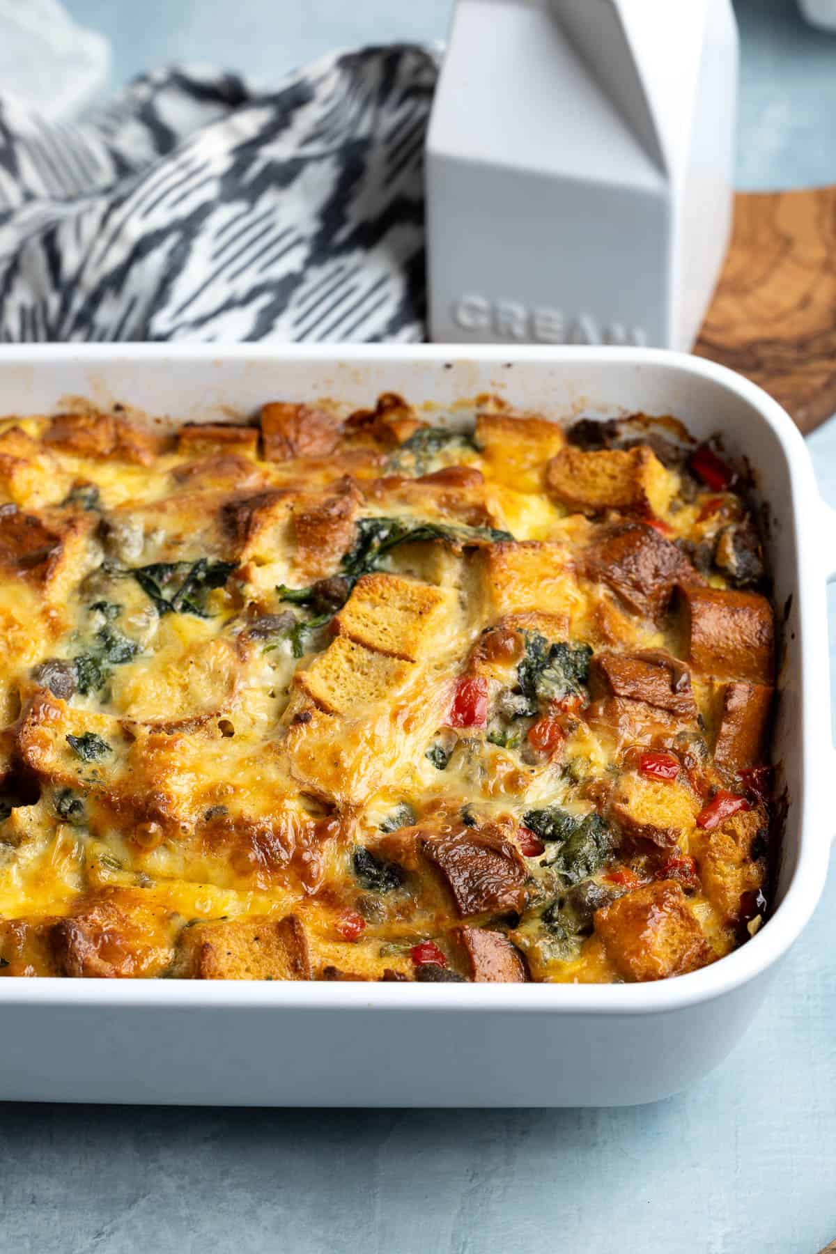 A baking dish full of baked sausage breakfast strata.