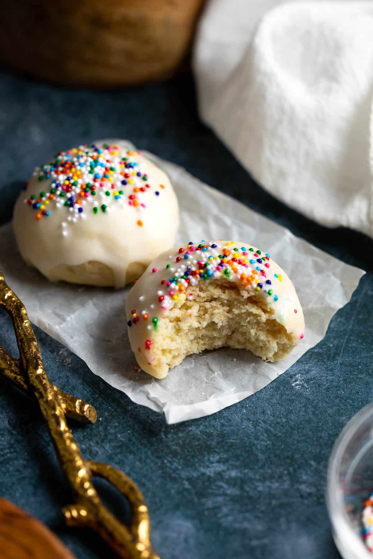 A bite taken out of an anise cookie.