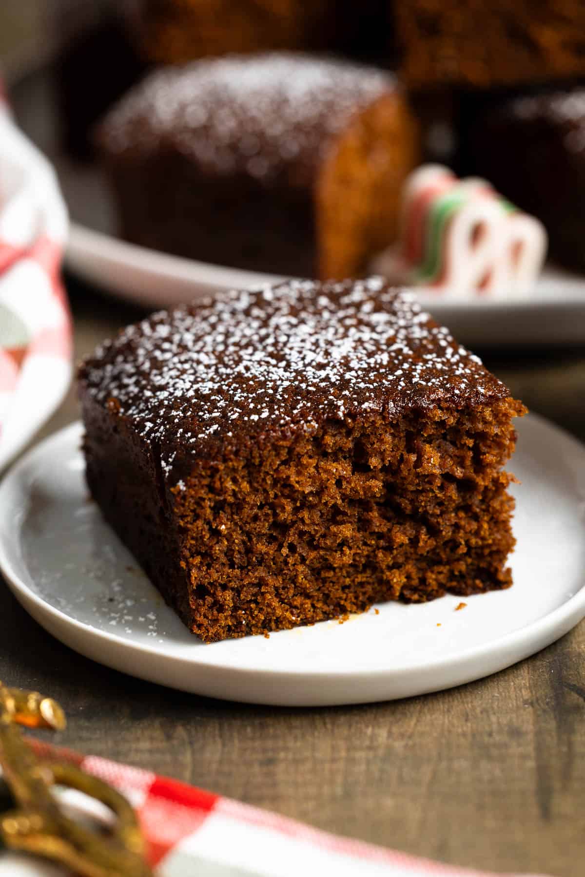 A slice of old-fashioned gingerbread on a dessert plate.