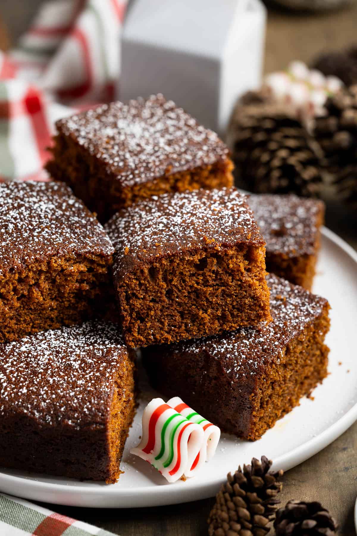 Squares of old-fashioned gingerbread on a serving plate.