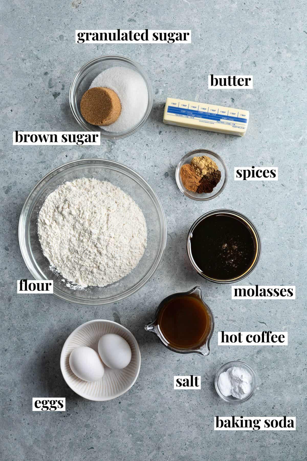 Text-labeled gingerbread ingredients in separate containers.