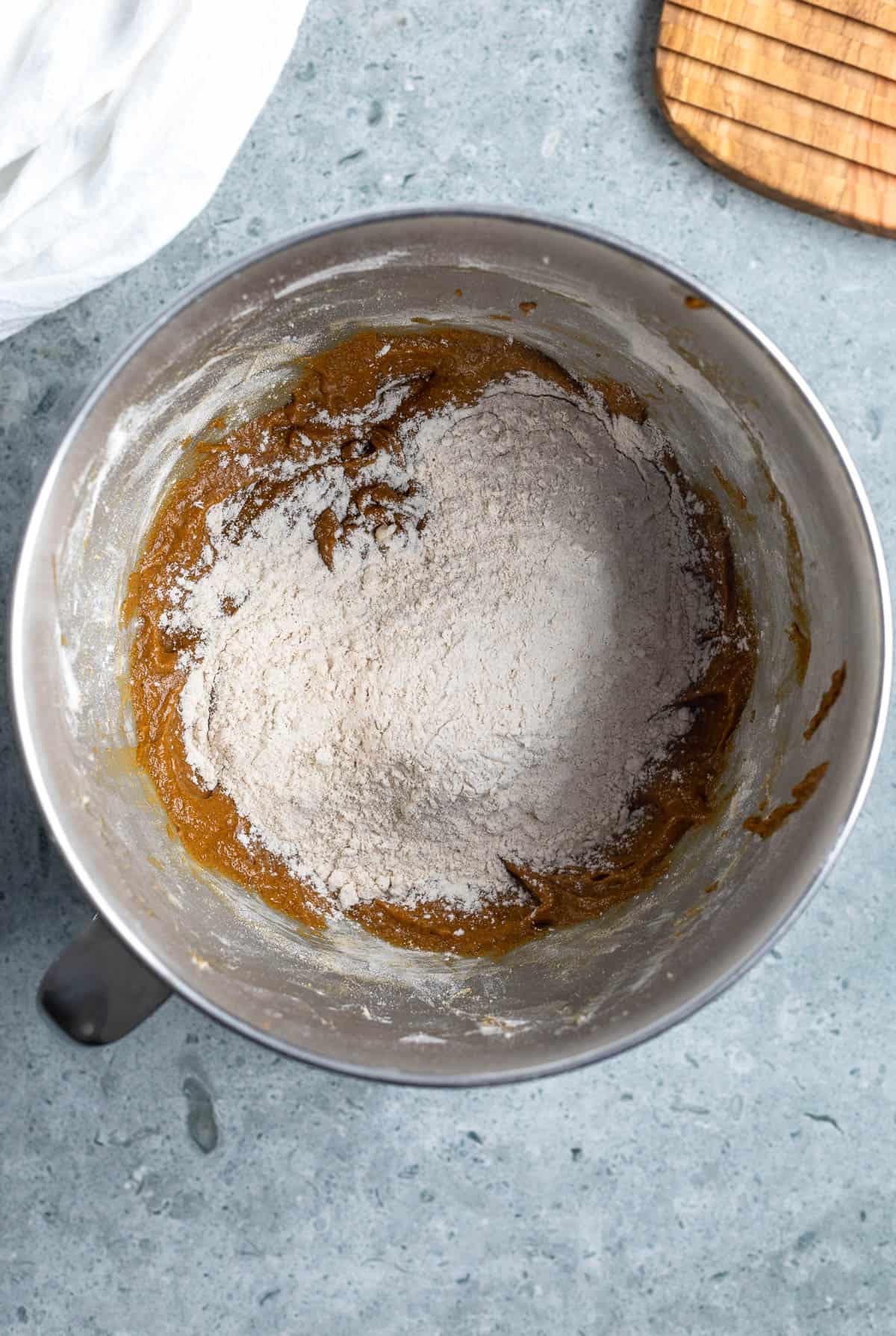 Dry ingredients added to the bowl of wet ingredients.