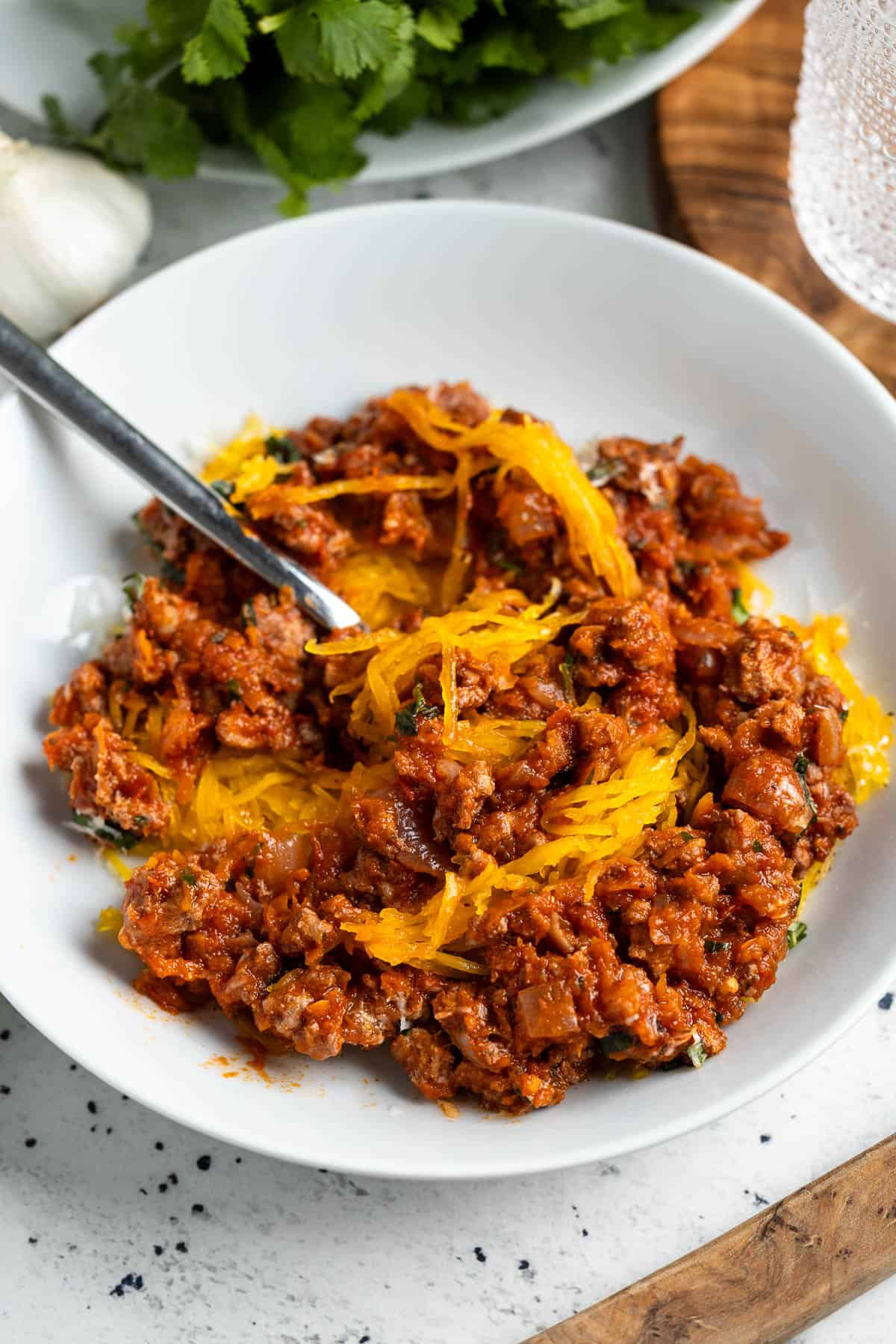 A bowl of spaghetti squash bolognese stirred together.