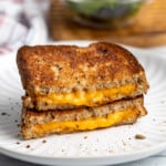 Two halves of an air fried grilled cheese stacked on top of one another.