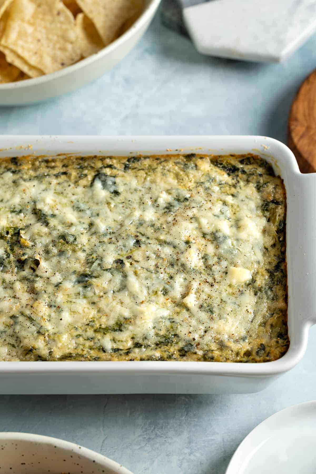 Spinach artichoke dip in a baking dish.