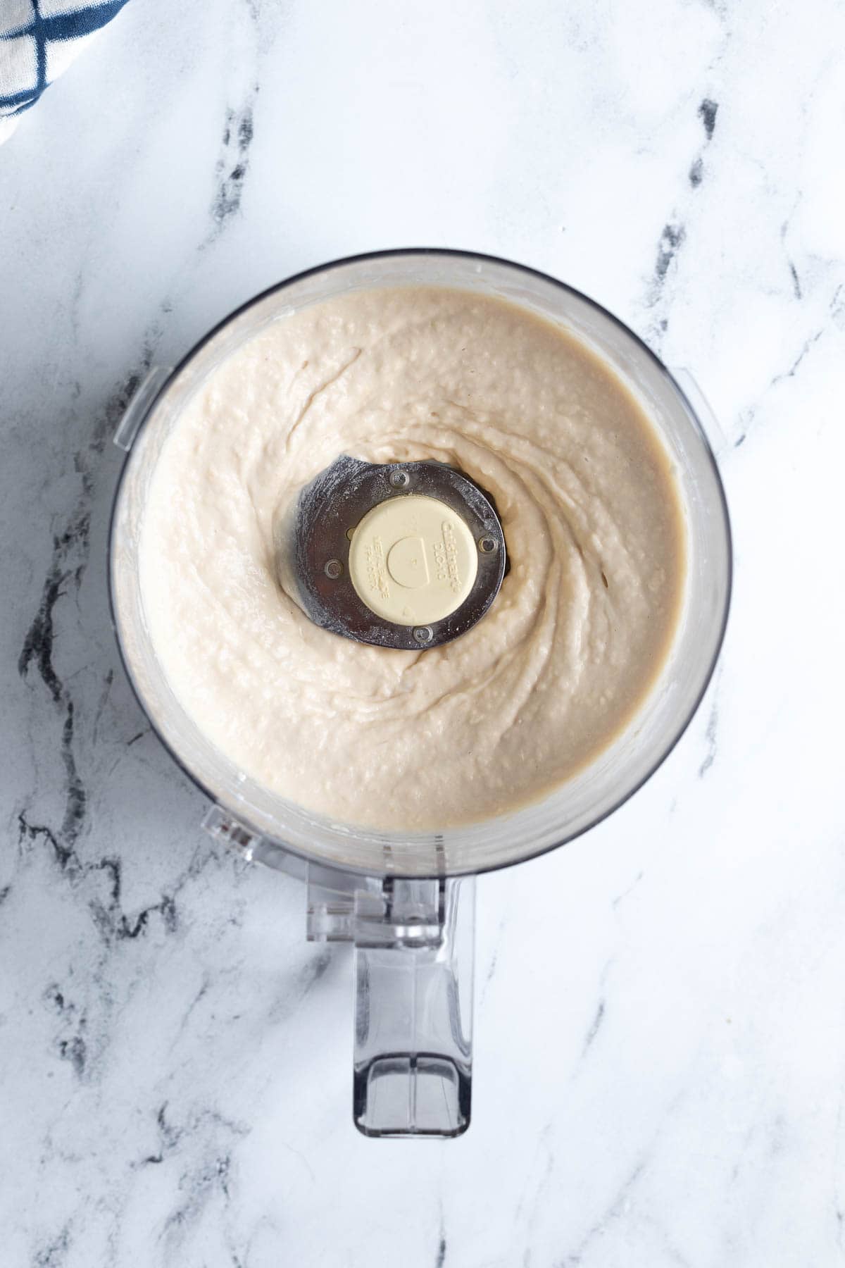 Blended white beans and cottage cheese in a food processor.