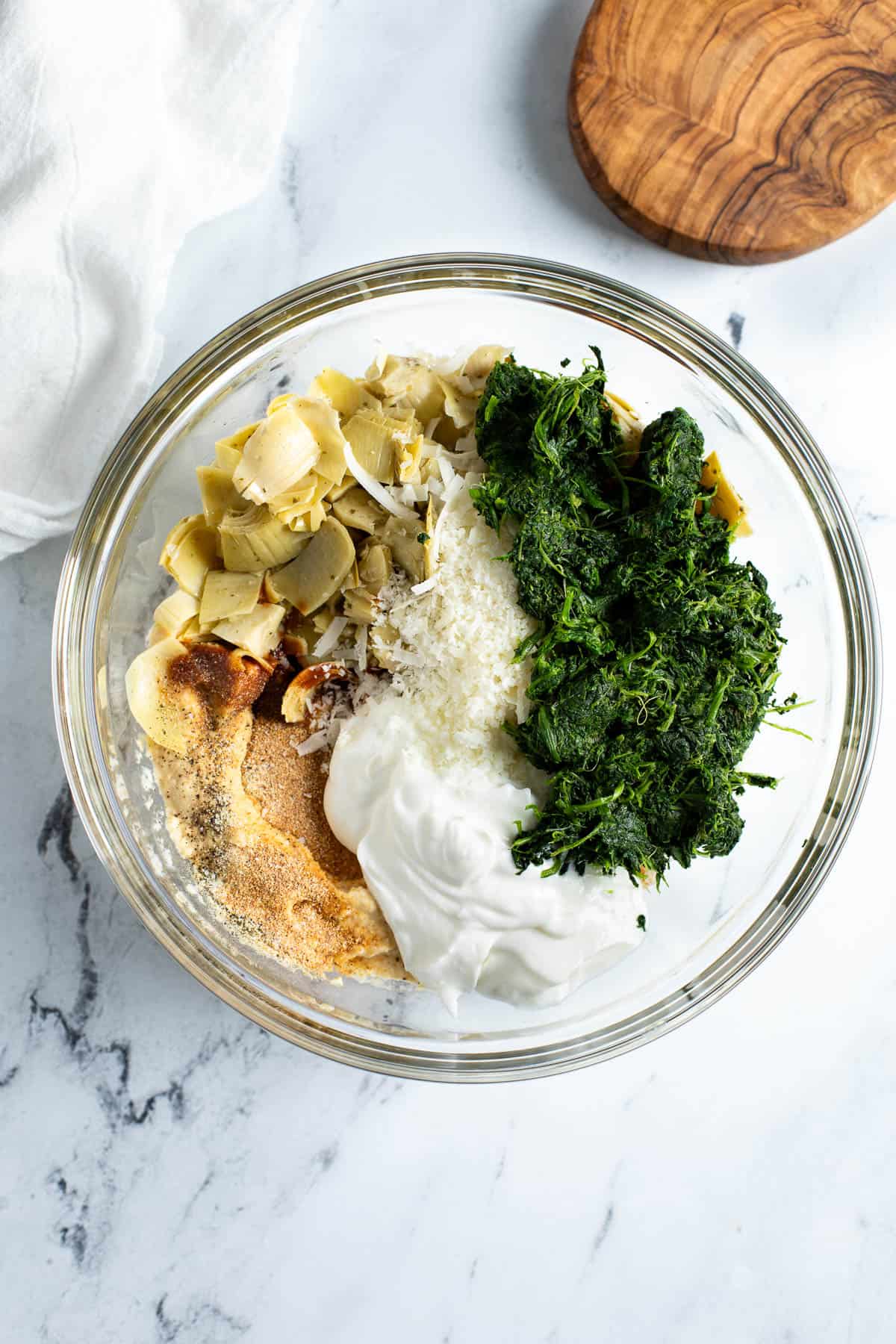 All ingredients added to a glass mixing bowl.