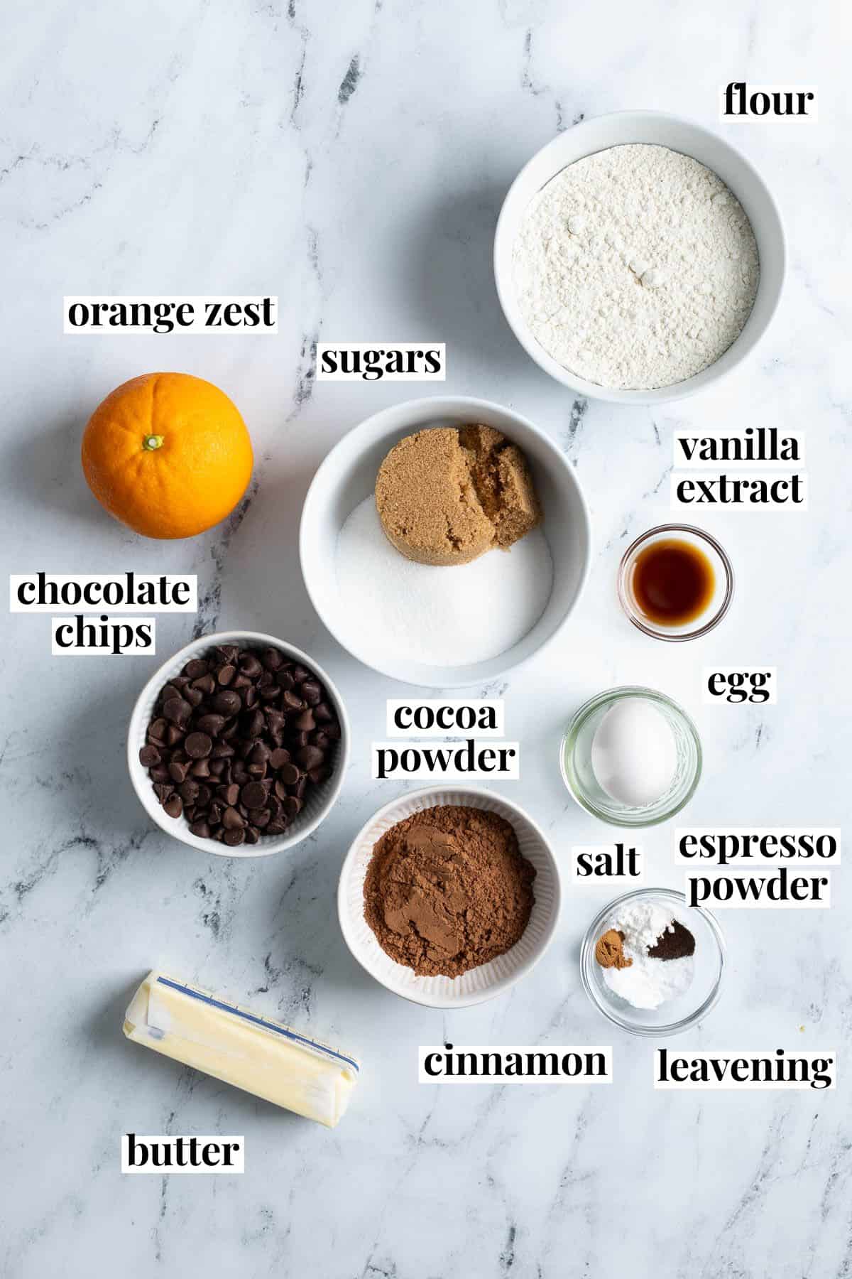 Text-labeled chocolate orange cookie ingredients in separate containers.