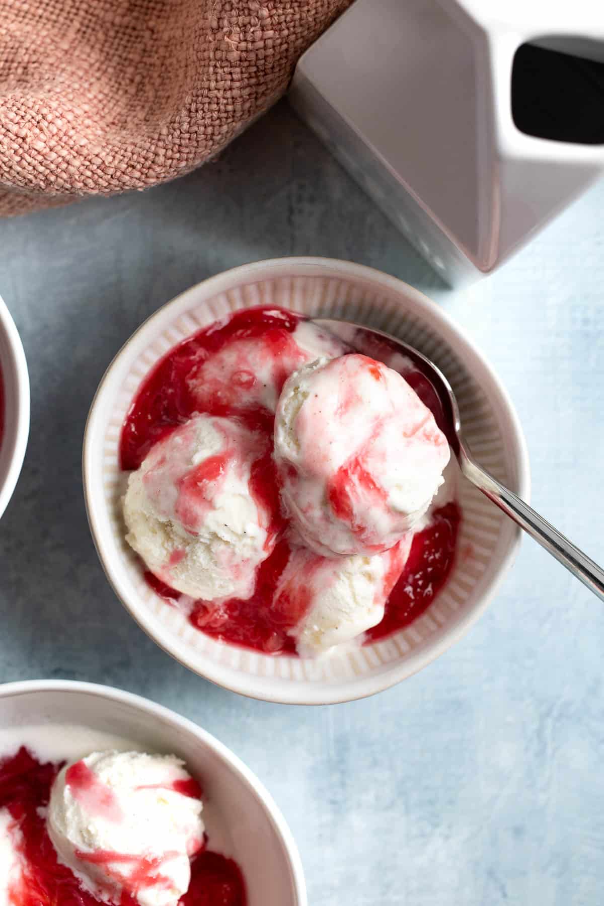 Warm stewed rhubarb served over vanilla ice cream.