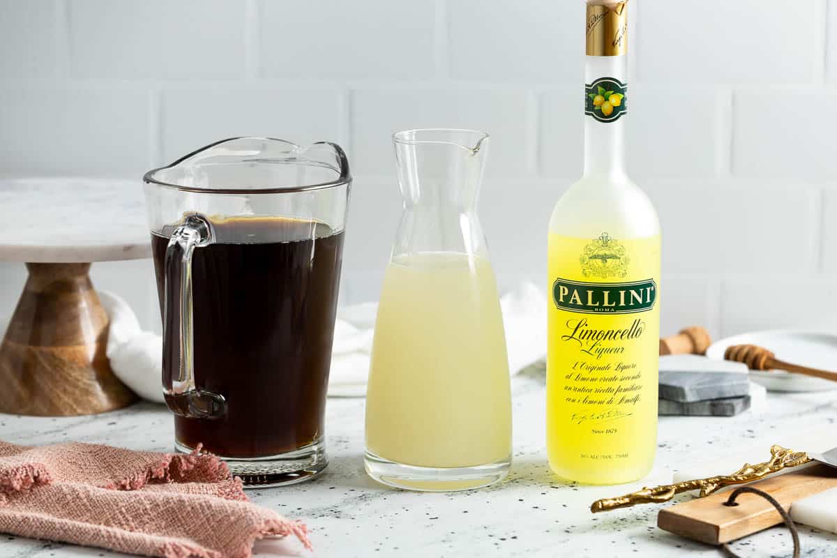 Pitchers and bottles of iced tea, lemonade, and limoncello.