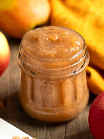 Chunky Instant Pot applesauce in a glass jar.