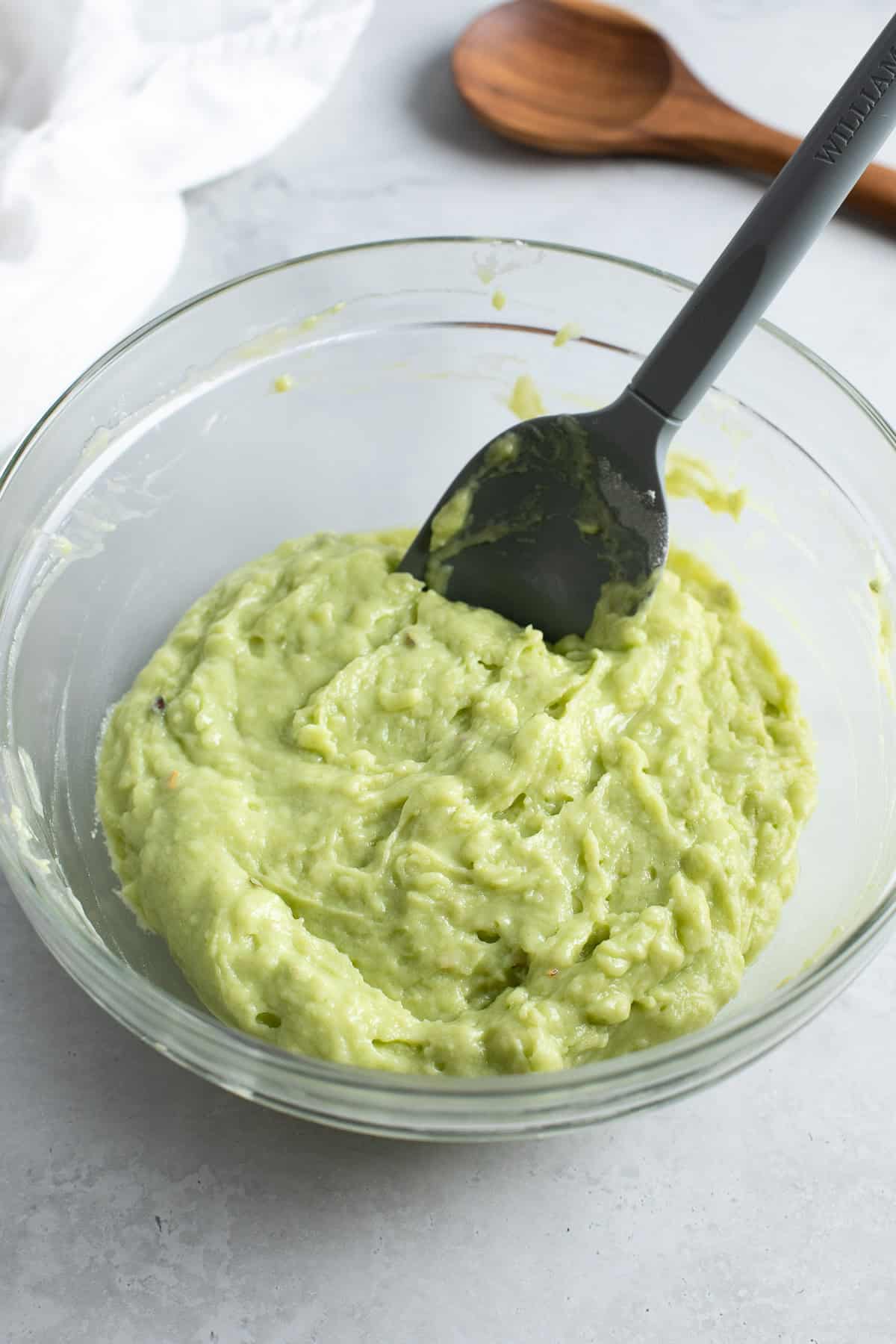 The muffin batter in a glass bowl.