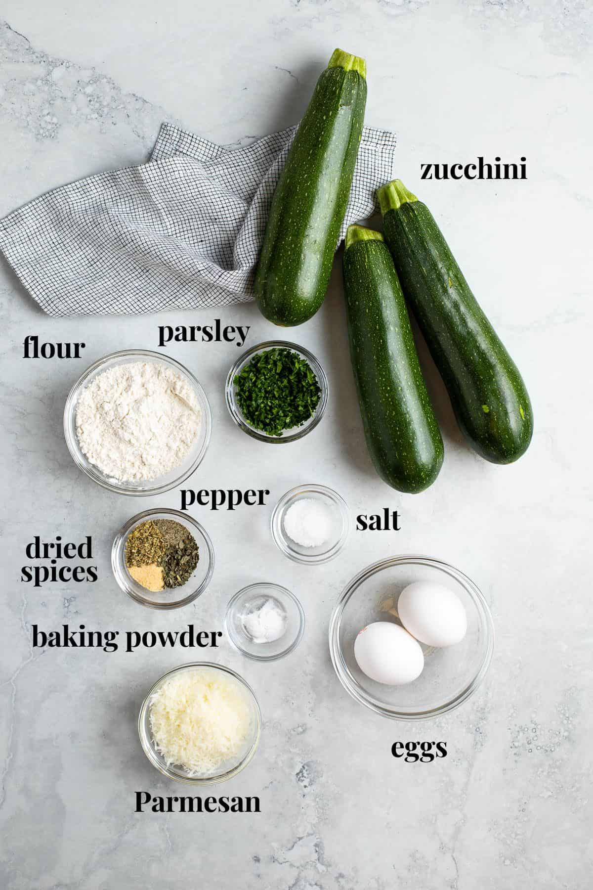 Text-labeled fritter ingredients in separate bowls.