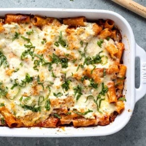 A large rectangular baking dish of baked pasta al forno.