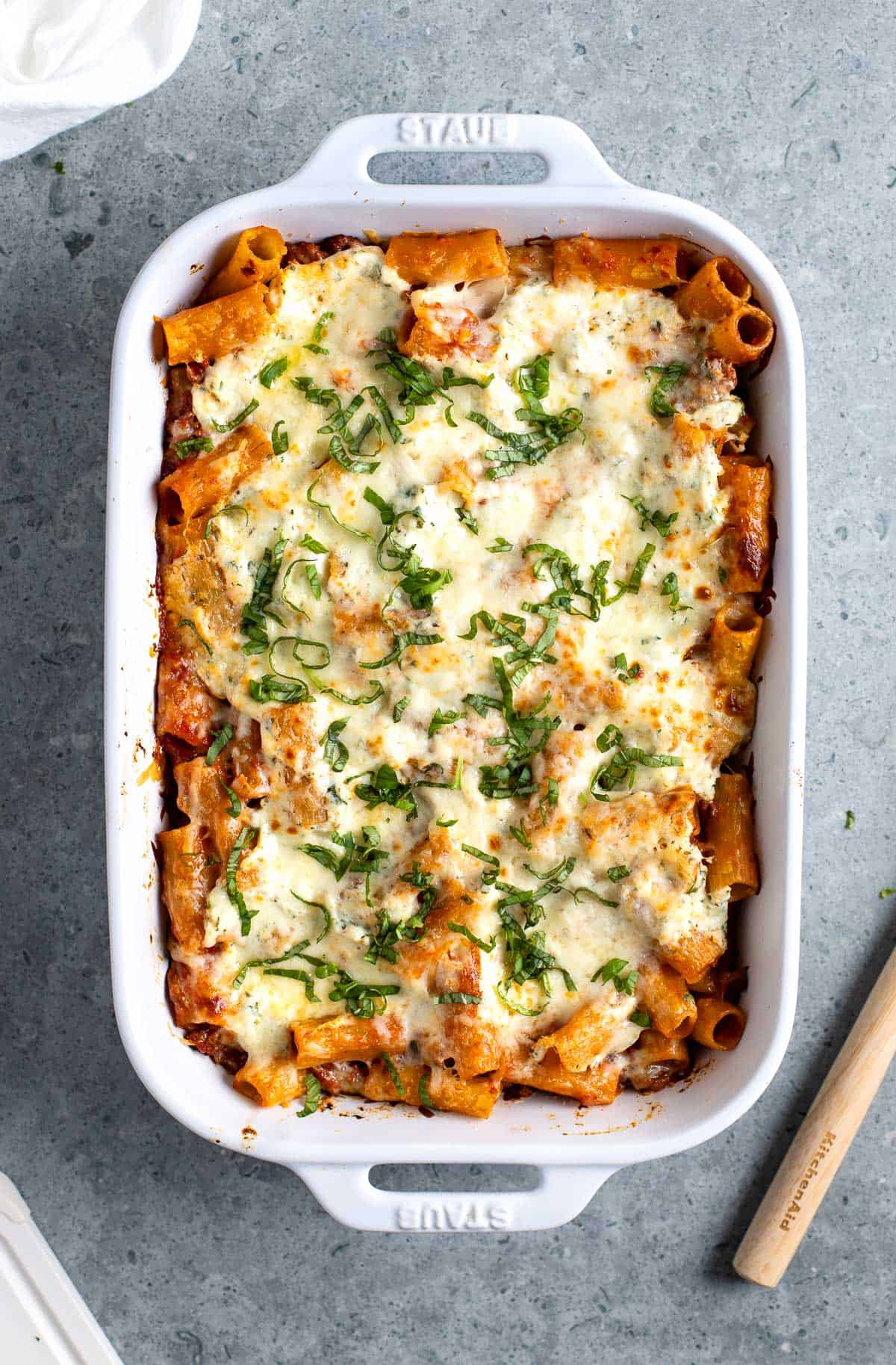 A large rectangular baking dish of baked pasta al forno.