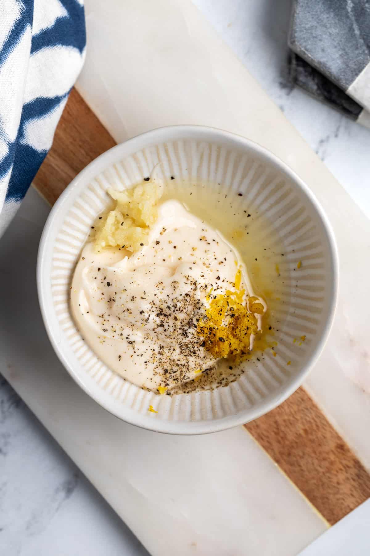 Easy lemon aioli ingredients in a bowl before mixing.